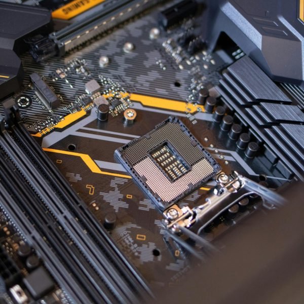 pexels-photo-2582937-2582937 Detailed view of a computer motherboard highlighting electronic components and technology connections.